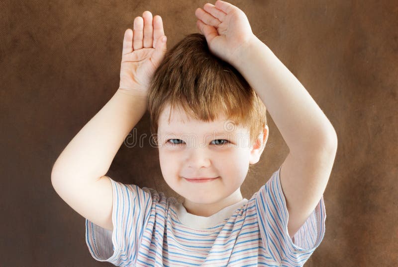 Little Boy Put His Hands To His Head Stock Photo Image of curiosity