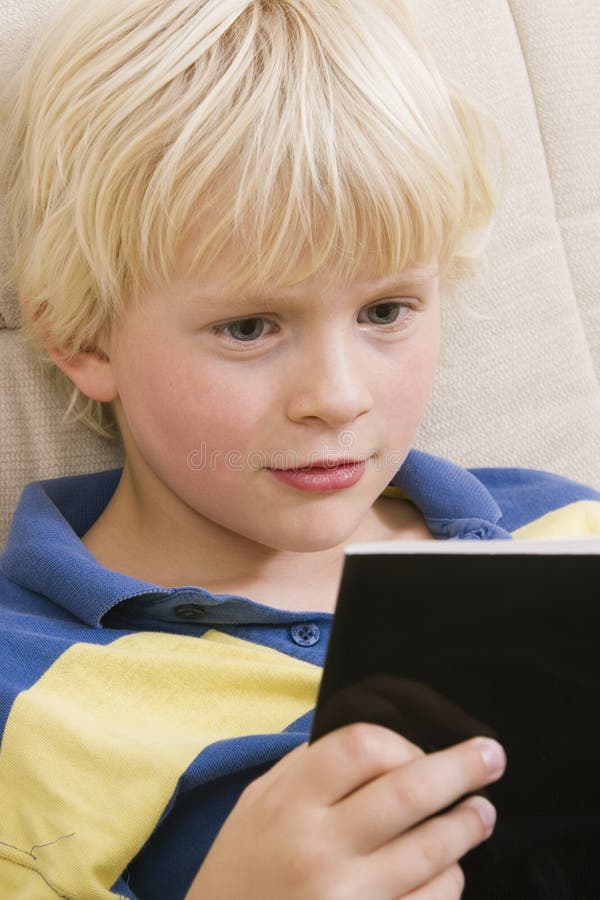 Little boy reading a book