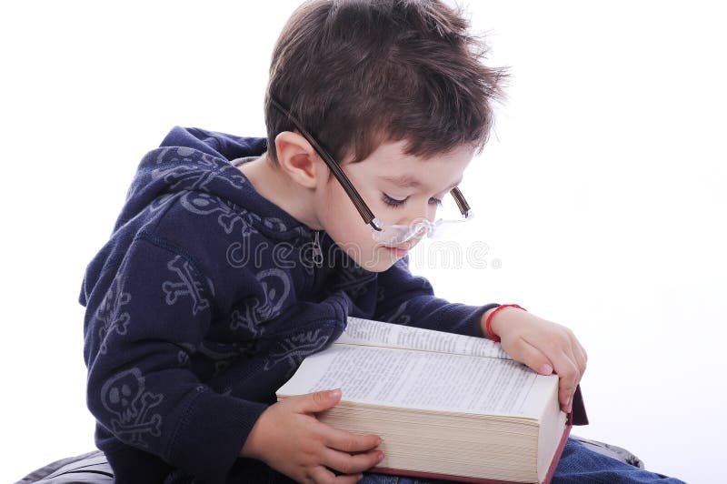 Little boy reading a book