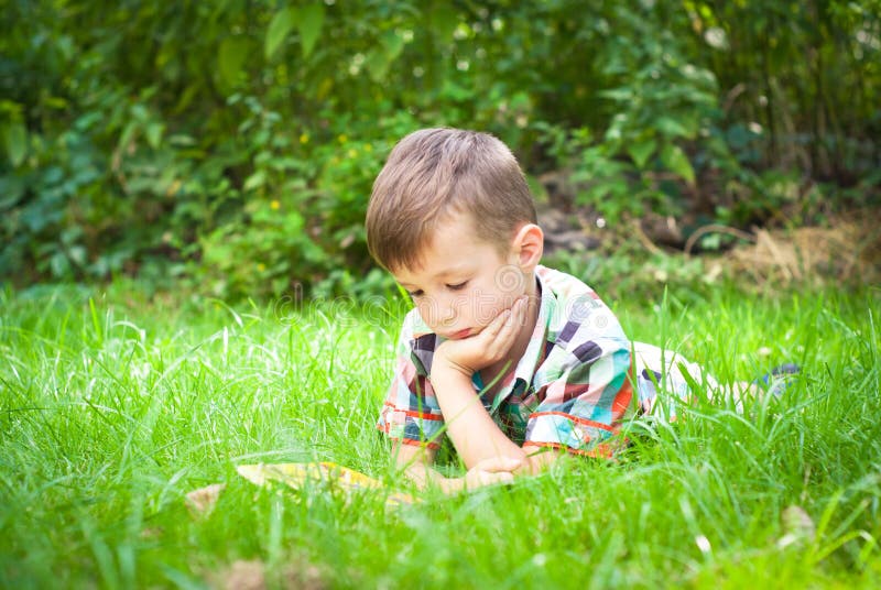 Little boy reading a book