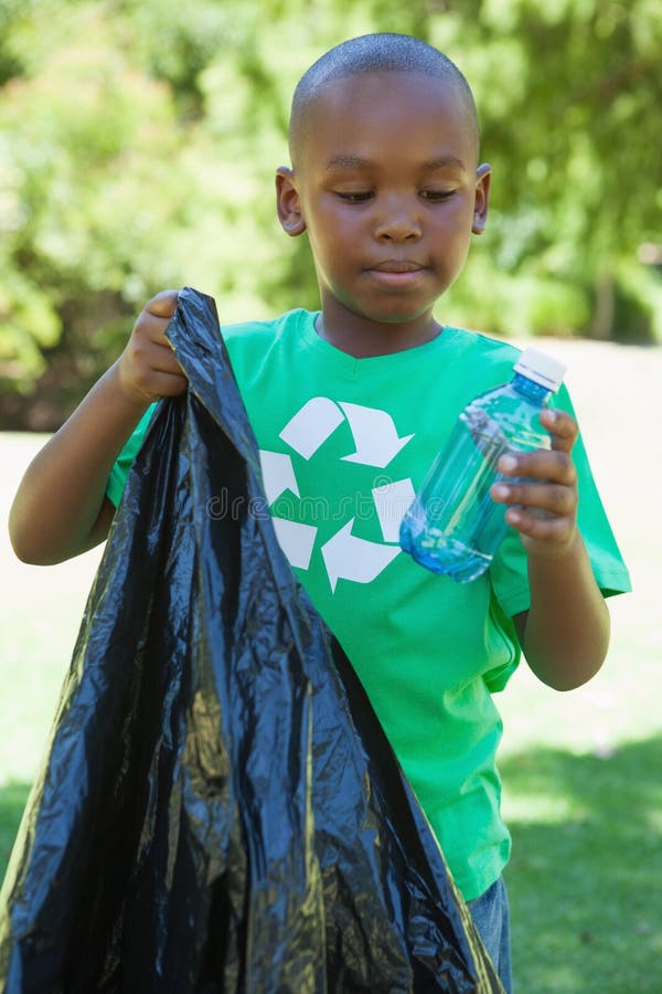 Little Boy In Recycling Tshirt Picking Up Trash Stock Image Image