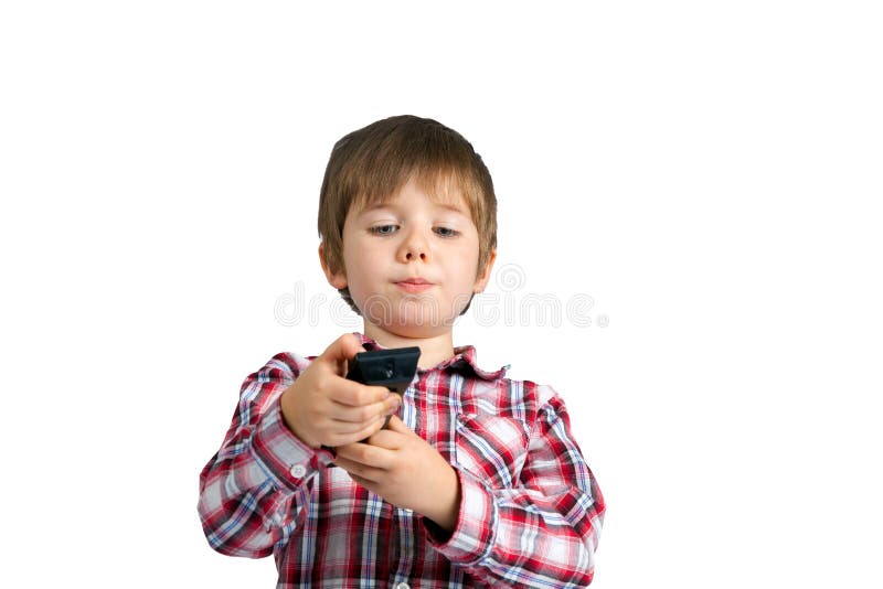 Little Boy With a Remote Control He Is Focusing On Which Button stock photo Little Boy With a Remote Control He Is Focusing On Which Button stock photo