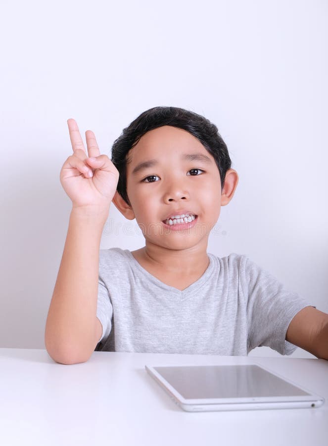 Little boy rise hand stock photography Little boy rise hand stock photography