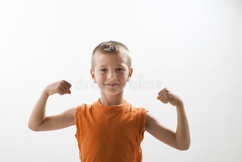 Little boy showing his muscles