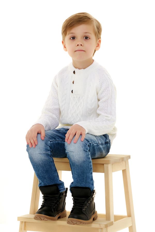 A Little Boy is Sitting on a Chair. Stock Photo - Image of seat, little