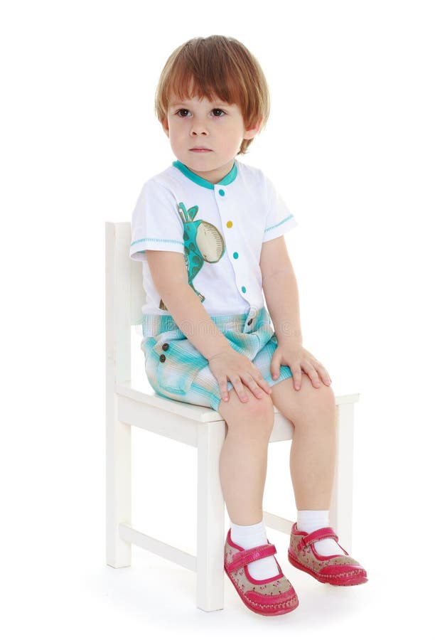 Little Boy Sitting on a Chair. Stock Photo Image of look, smile 41829732