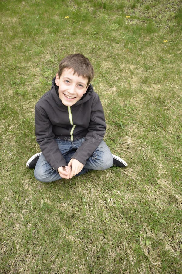 Little Boy Sitting on Grass Stock Image - Image of hair, flowers: 93192341