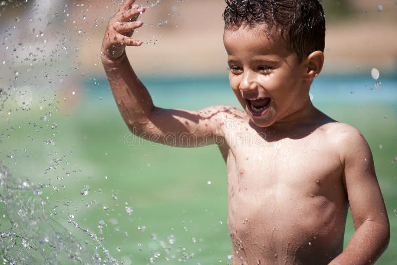 Little Boy Splashing Water Stock Photo Image Of Energy 25800528