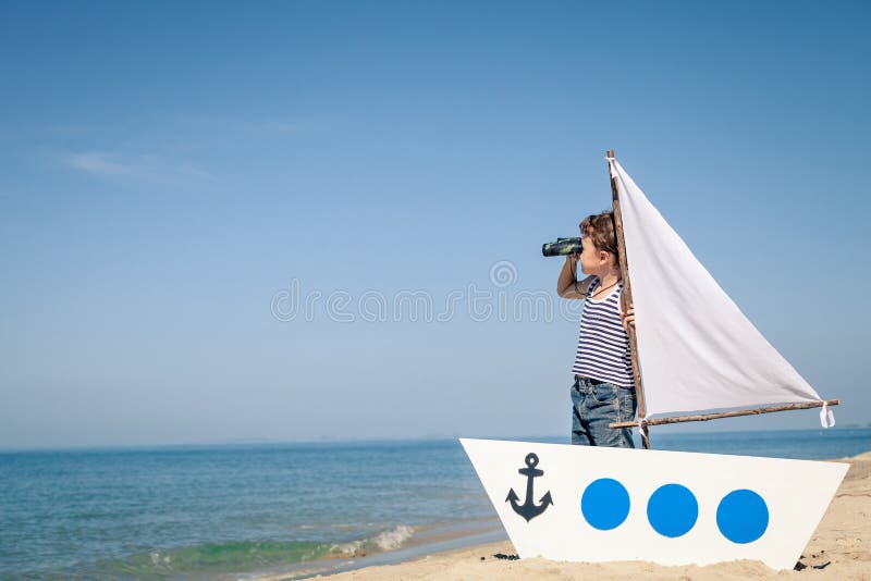 Little boy standing on the beach