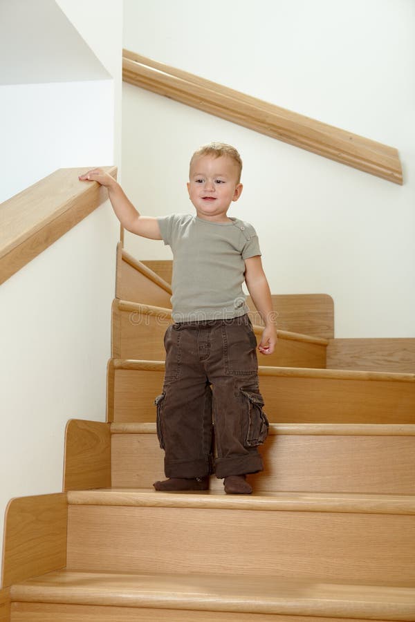 Little boy standing on stairs