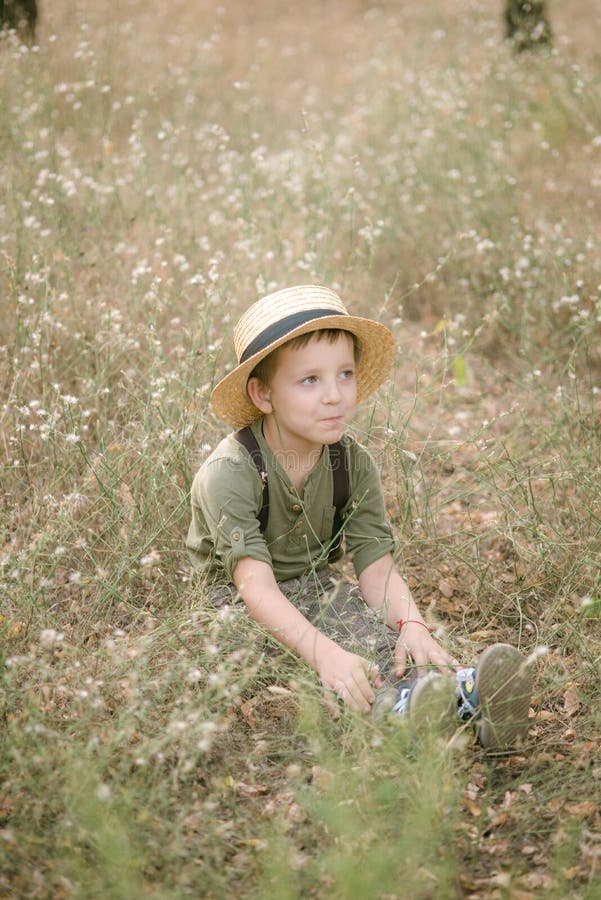 Little Boy in a Straw Hat in the Park in the Summer Stock Image - Image ...