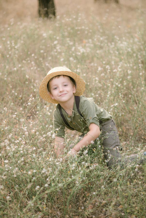 Little Boy in a Straw Hat in the Park in the Summer Stock Photo - Image ...