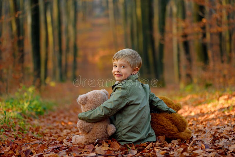 A little boy playing in the autumn park. royalty free stock photo A little boy playing in the autumn park. royalty free stock photo