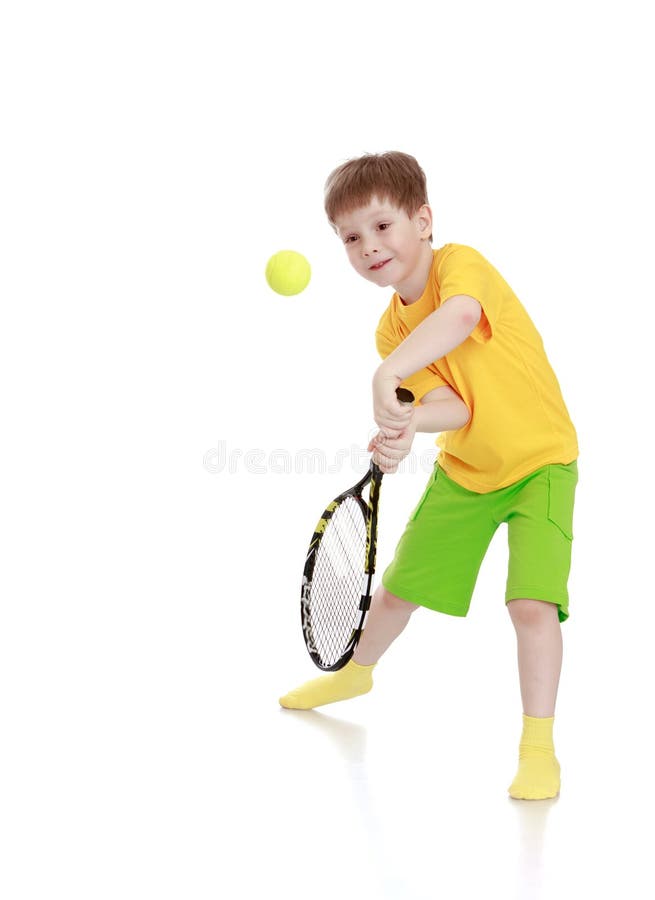 Little Boy with a Tennis Racket while Hitting the Stock Image Image