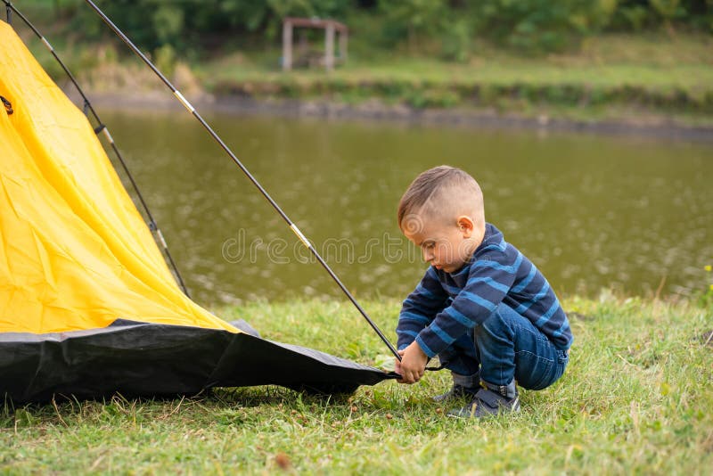 Little Boy in a Tent. Camping in the Nature Stock Photo Image of