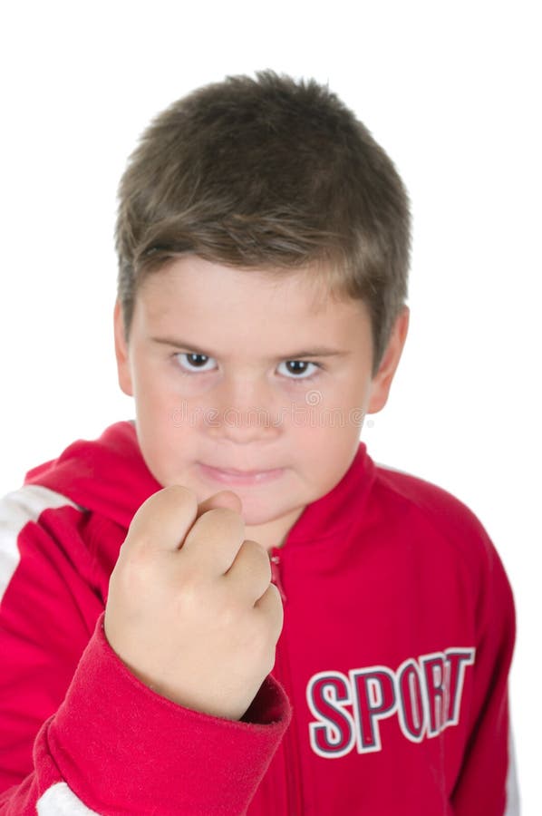 Little boy threatens with a fist