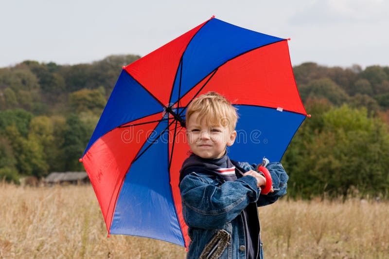 Little boy with umbrella stock photo. Image of family 11230600