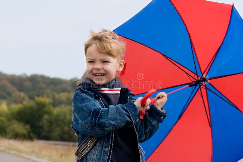 Little boy with umbrella stock photo. Image of family 11230600