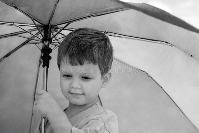Little Boy Under an Umbrella. Stock Photo Image of male, life 28671152