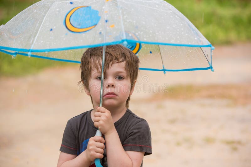 Little boy under umbrella stock photo. Image of fall 93823974