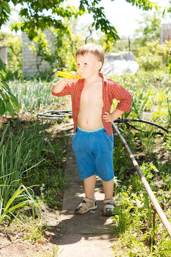 Little Boy in the Vegetable Garden Stock Photo - Image of handsome ...