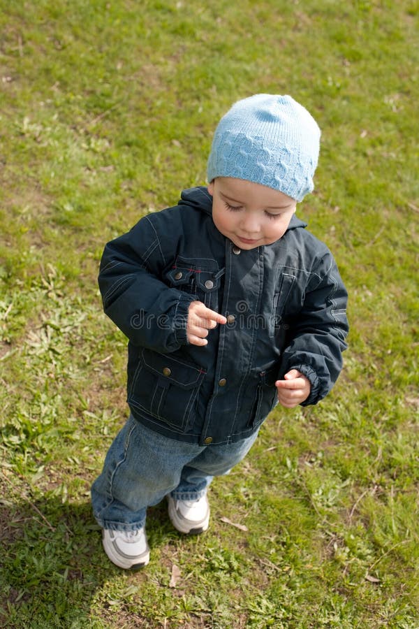 Little Boy Walking on the Spring Meadow Stock Image - Image of luck ...