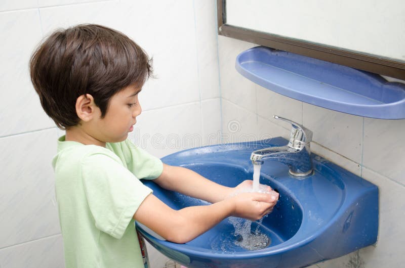 Little boy washing hand stock image. Image of childhood - 43472407
