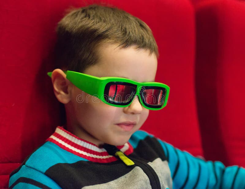 Little boy watching movie. stock photo. Image of looking 68564742
