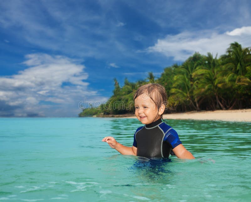 Little boy in the wetsuit stock image. Image of wetsuit 25730345