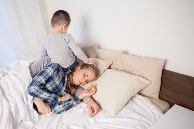 Little boy woke the parents in the bedroom royalty free stock image Little boy woke the parents in the bedroom royalty free stock image