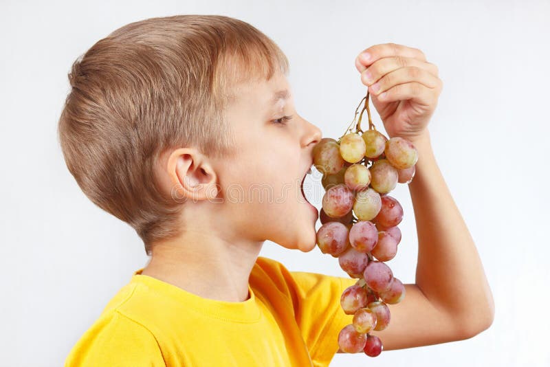 Little Boy Yellow Shirt Eating Ripe Grape Stock Photos Free & Royalty