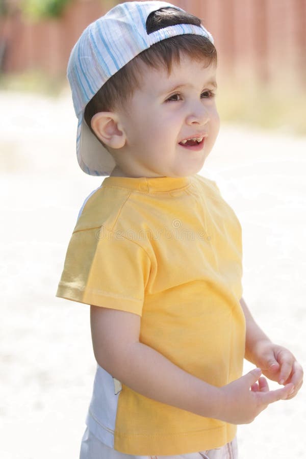 Little Boy in Yellow Shirt Looking Sideways Stock Photo Image of