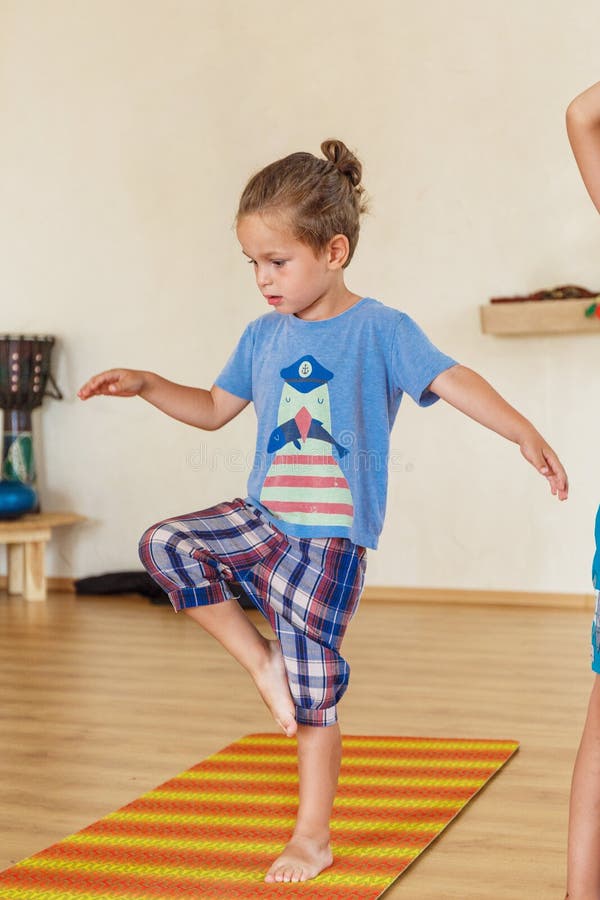 Little boy on a yoga class stock image. Image of fitness 83949637
