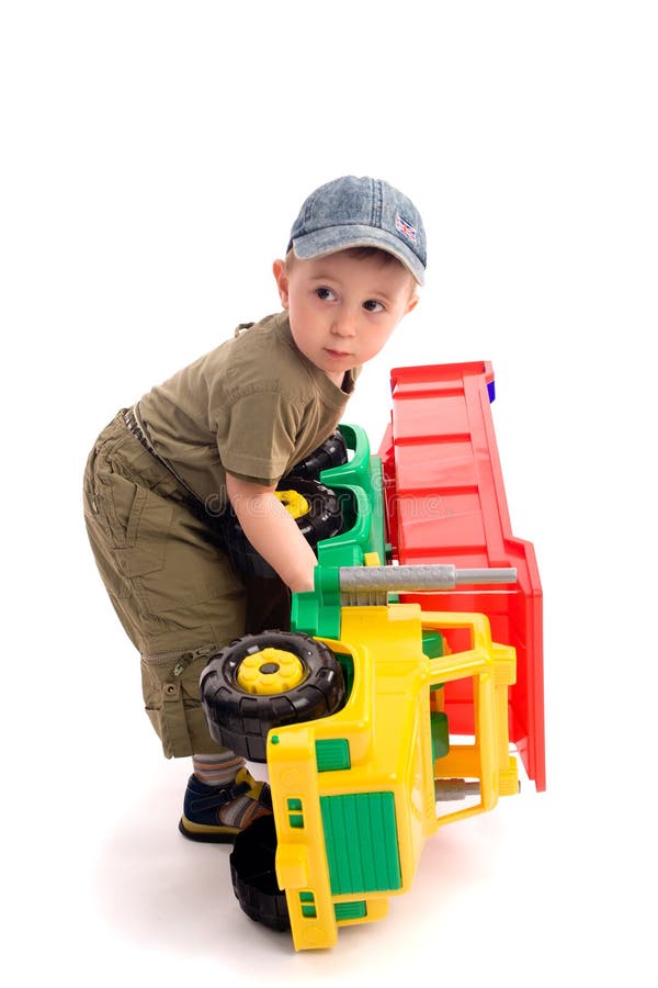 Little boys play with toy truck