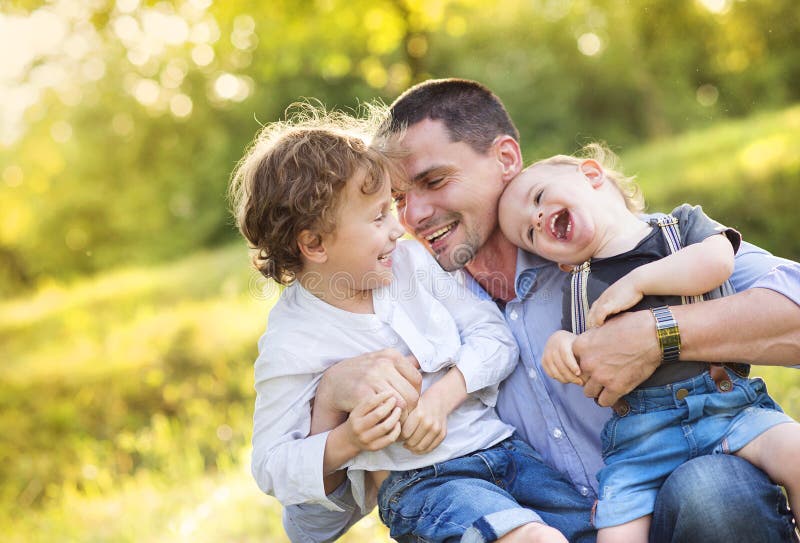 Little boys with their dad. Happy, play.