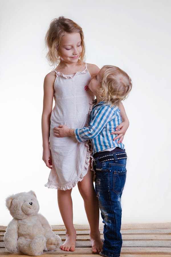 Little Brother And Sister Playing Together In A Room Stock Image 