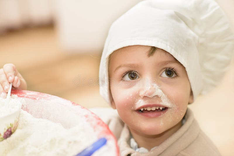 A sweet child playing in the kitchen. A sweet child playing in the kitchen