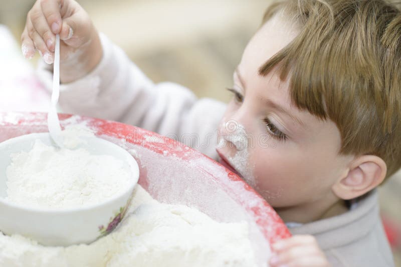 A sweet child playing in the kitchen. A sweet child playing in the kitchen