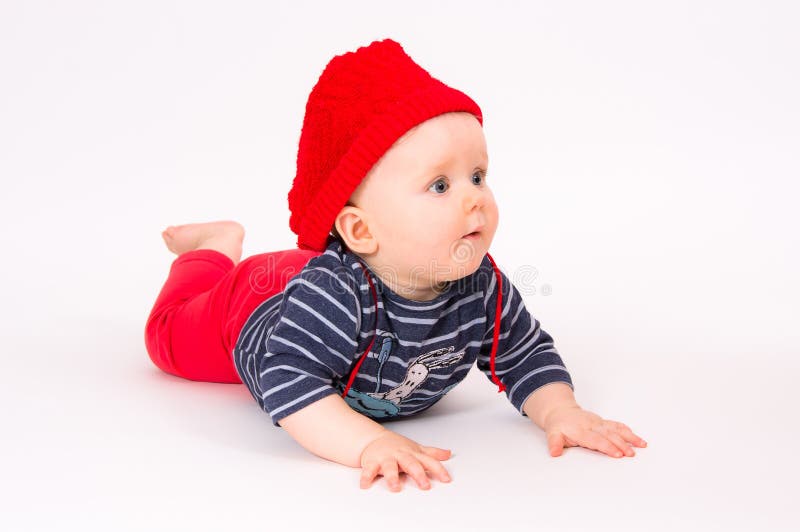 Little child baby in a red hat