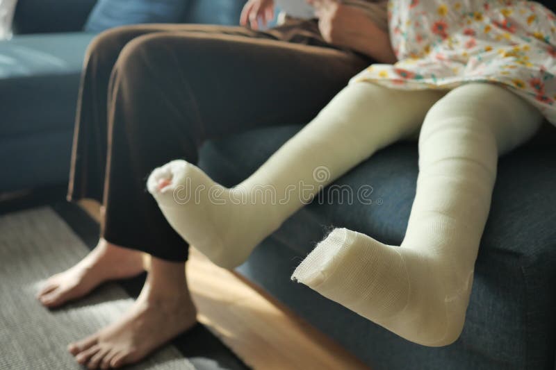 Little Child with Plaster Bandage on Leg. Stock Photo Image of