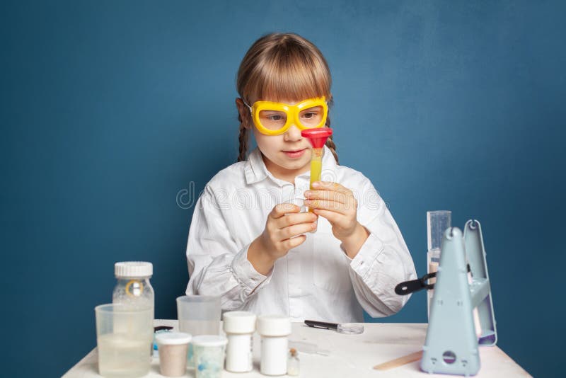 Little Child Girl Having Fun while Doing Science Experiments Stock