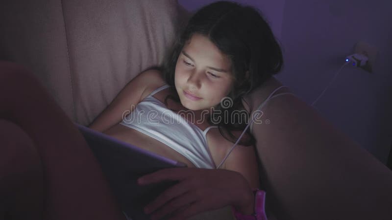 Little Child Girl Using Tablet at Night. Girl Teen Plays Online the Games Social Media. Girl and Tablet Concept Stock Footage - Video of dark, light: 117419858