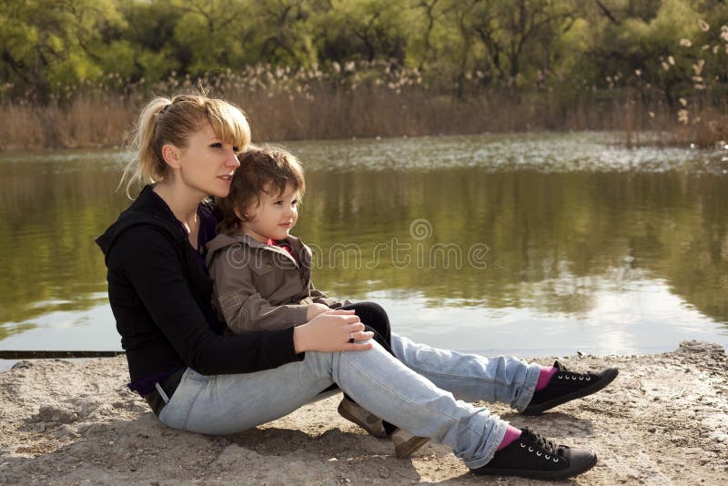 Little child with his mother looking away