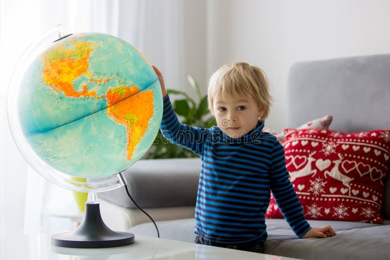 Little Child, Looking at Illuminated Globe, Exploring Stock Image 