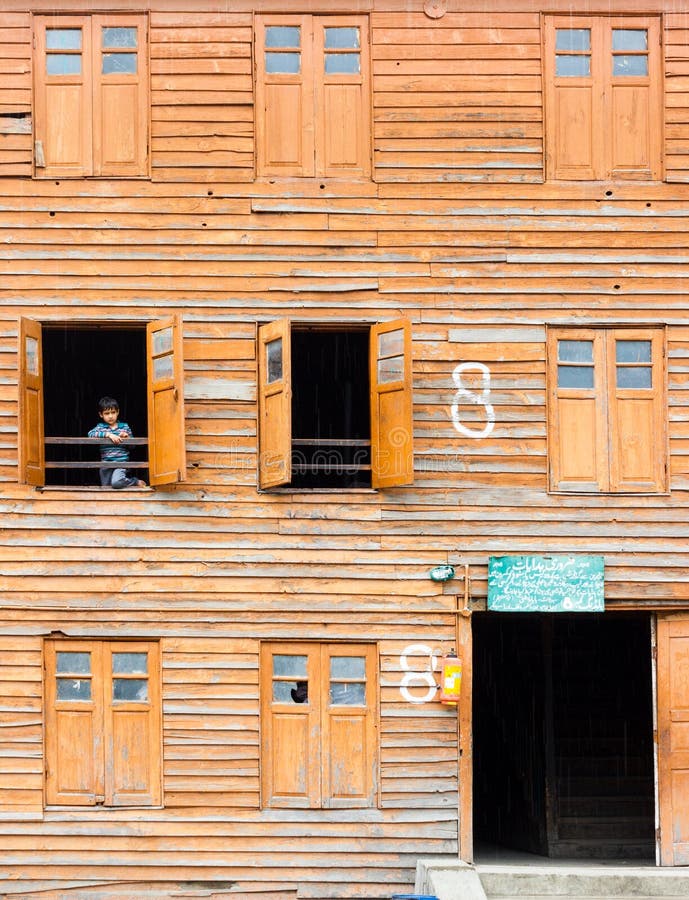 Little child peeping, Buddhist monastery stock photo