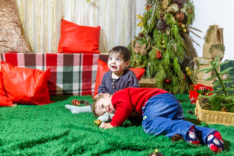 Little Child Playing with Christmas Decorations in Studio, Little Child