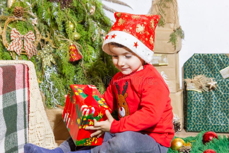 Little Child Playing with Christmas Decorations in Studio, Little Child