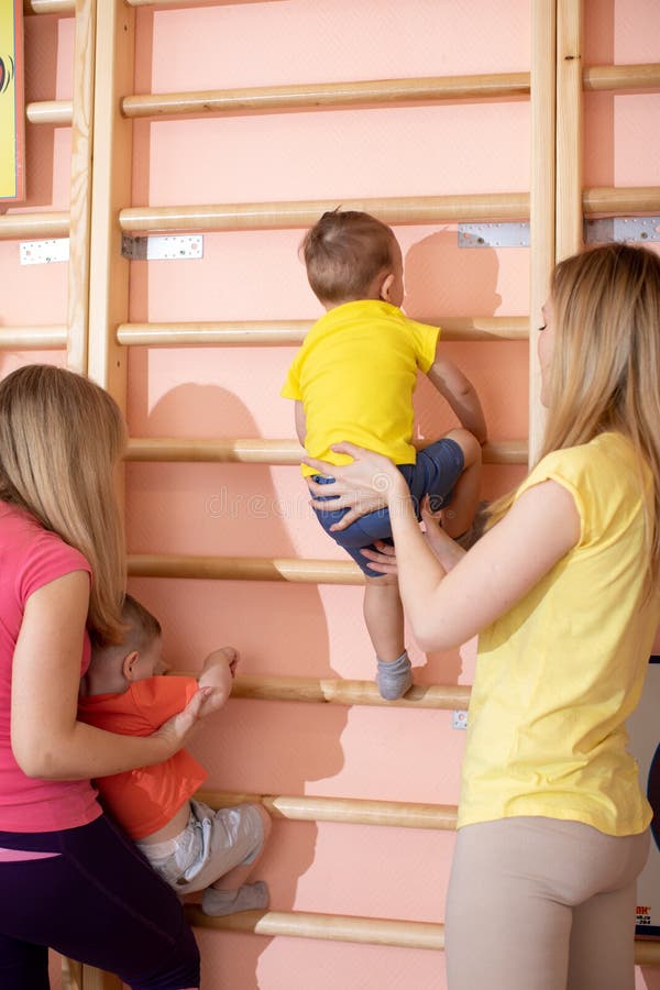 Little children toddlers climbing up the gymnastic stairs. Healthy lifestyle from childhood royalty free stock photography Little children toddlers climbing up the gymnastic stairs. Healthy lifestyle from childhood royalty free stock photography
