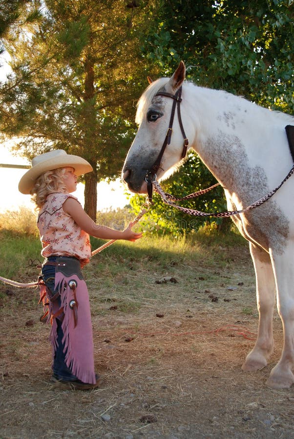 Little cowgirl with pony.