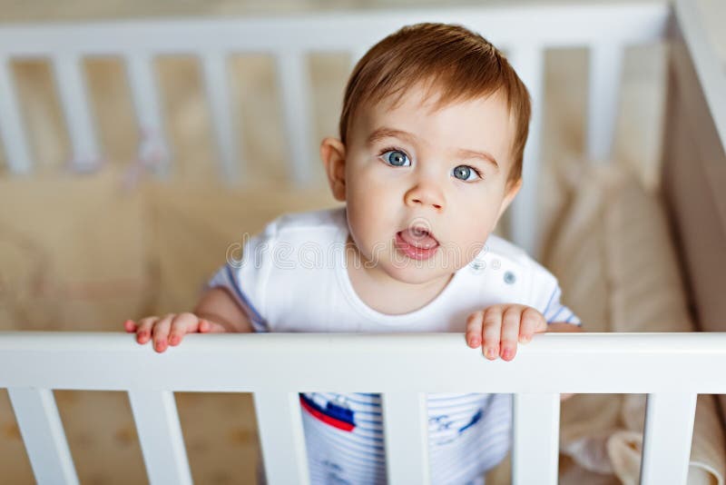 Little cute adorable little blond boy in a striped bodykit is in royalty free stock photography Little cute adorable little blond boy in a striped bodykit is in royalty free stock photography